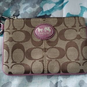 Pink and beige Coach Wristlet
